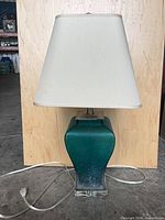 Front view of lamp with shade, cord visible