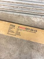 Shipping box labeled CM020QBS-BK-LN Queen Metal Box Spring in Black Linen