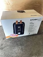 Front view of boxed KitchenSmith 2-slice toaster