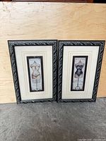 Both framed prints side by side