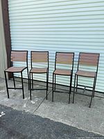 All four matching bar stools lined up