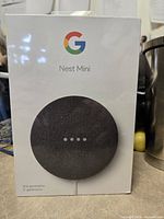 Front of sealed Google Nest Mini 2nd Gen retail box