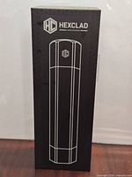 Front of unopened Hexclad box showing outline of grinder