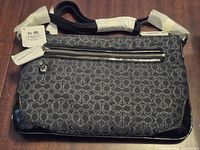 Front view showing Coach signature jacquard, patent corners, tag, front zipper