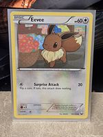 Front of Eevee card in sleeve
