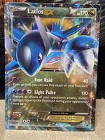 Front view of Latios EX promo card showing artwork, stats and XY72 identifier