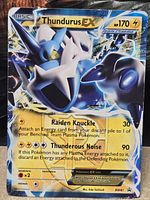 Front of Thundurus EX BW81 holographic card showing artwork stats and attacks
