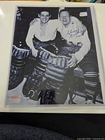 Full view of signed photo showing both players