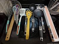 All utensils and rolling pin laid out on stovetop