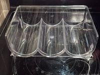 front view showing three curved bottle slots