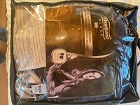 Front of original packaging showing brand, blanket image, and controller