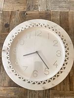 Front view showing marble pattern, dotted numerals and hands