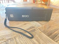 Front view showing Kodak logo, 600 badge, wrist strap