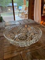 angled view of clear cut glass bowl on wooden table