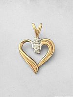 Front view showing heart shape and diamond cluster