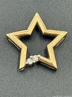 Front view showing open star shape and diamond cluster