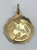 Front view showing unicorn engraving and radiating border