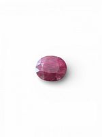 Front view of oval brilliant cut ruby showing overall shape and color
