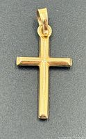 Front view of 14k gold cross pendant