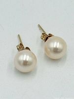 Front view of both pearl earrings showing luster and mount
