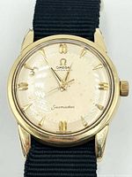 Frontal view showing dial, hands, markers and Omega Seamaster text