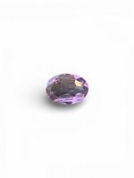 Top view of faceted oval amethyst showing colour and cut