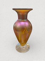 Full view of iridescent art glass vase front profile
