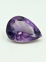 Front view pear-cut amethyst showing facets and color