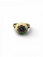 Top view of ring showing jadeite cabochon and enamel flower