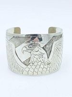 Front view showing high-relief eagle design on cuff