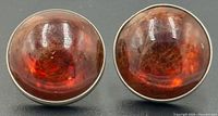 Front view showing both amber cabochons in sterling settings