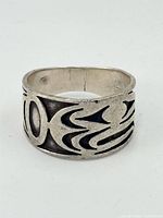 Front view of sterling silver band ring showing cut-out Indigenous design