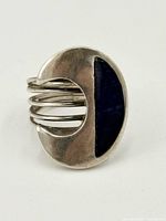 Front view showing crescent face with lapis inlay and wire shank