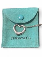 Necklace displayed on turquoise Tiffany & Co. pouch