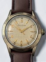 Front view showing dial, hands, numerals, Bulova logo