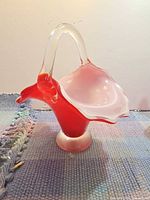 Front angled view of red art glass basket