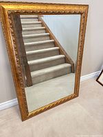 Full view of the framed beveled mirror front