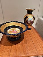 Compote bowl and vase on table