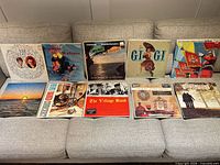 Ten LPs laid out on sofa, full lot overview