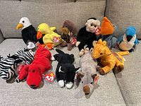 All eleven Beanie Babies arranged on sofa