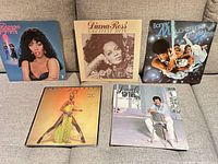 All five LPs arranged on sofa