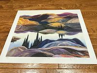 Full view of unframed print on wood surface