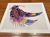 Full view of print showing colourful stylized bird and white border