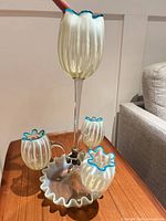 Full view assembled epergne showing four vases and blue rims