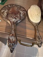 Front view of mirror and brush showing design and bristles