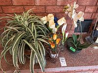 Group showing all artificial plants and flowers on countertop