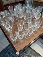 Tabletop view of assorted clear crystal and glass stemware pieces