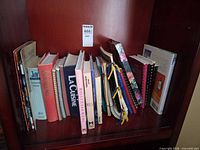 Shelf with entire cookbook lot showing all bindings and titles