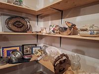 Overall view of assorted items on shelving