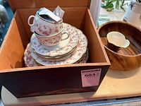 Stack of Bridal Rose plates and teacups inside a wooden box